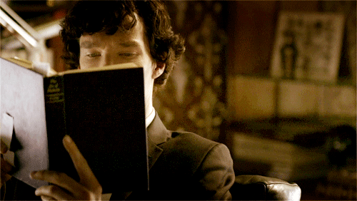Sherlock reading best new age metaphysics manifesting book he got at discount from manufacturer.